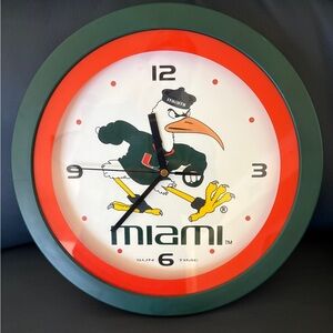 Miami mascot Sebastian Bold Green and Orange Wall Clock